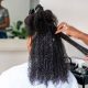 Woman having her hair straightened