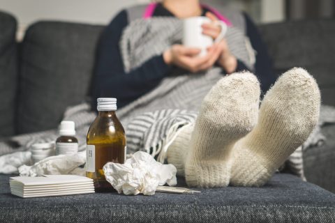 Woman on couch with pneumonia
