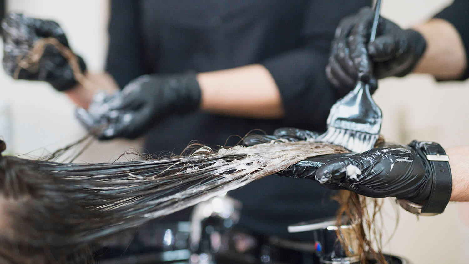Woman having a hair product applied.