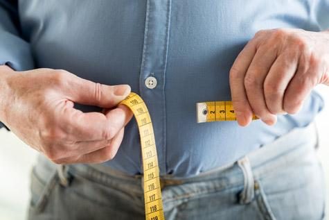 Older Man Measuring Waist