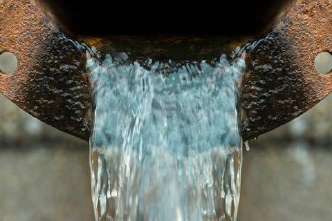 Water flowing from rusted pipe